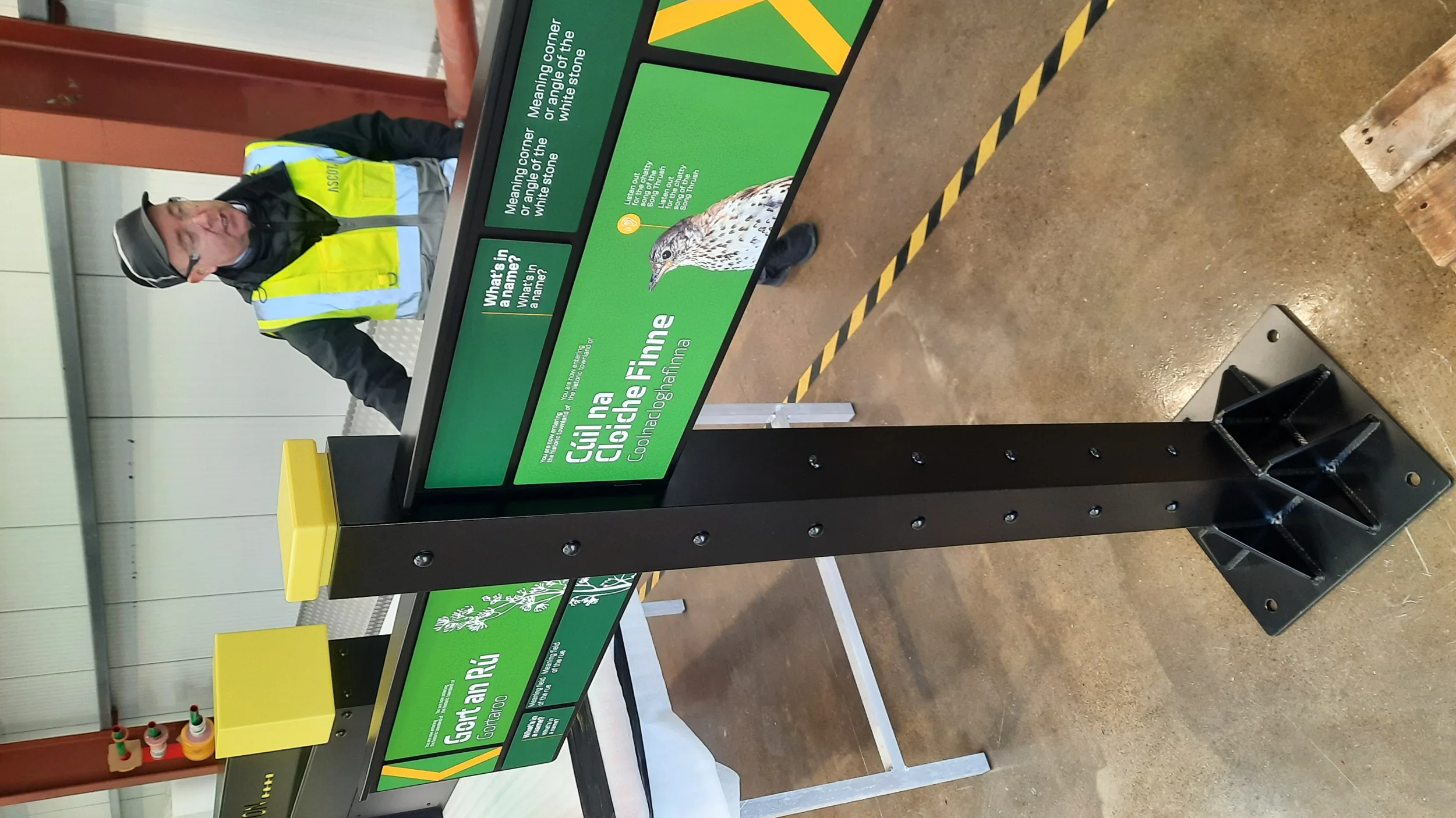 Signage boards under assembly at the fabricator.